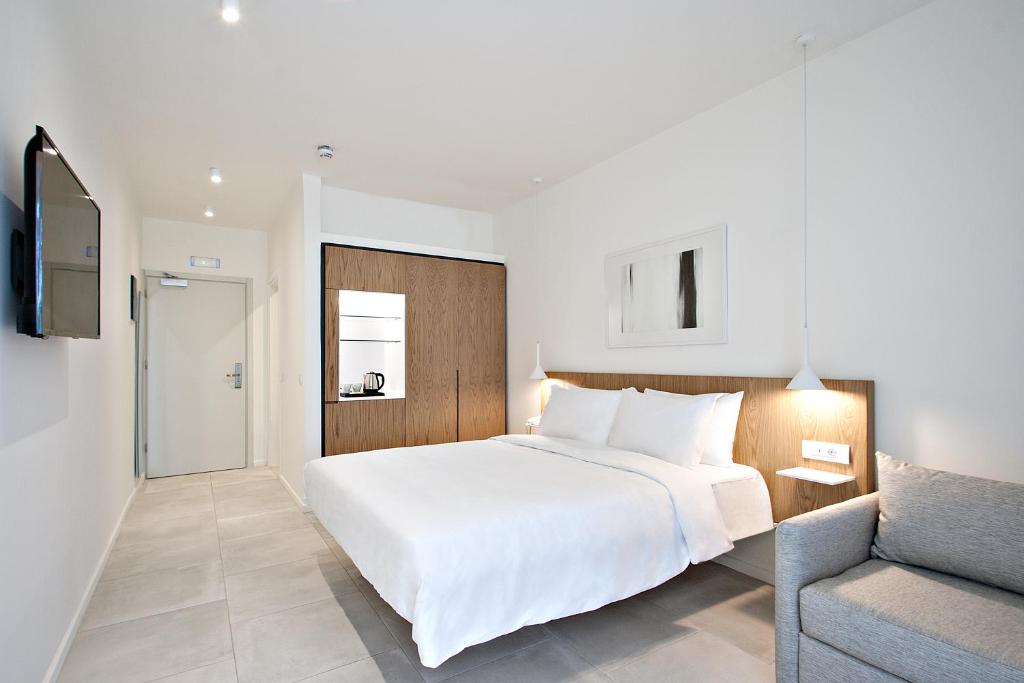 Tempat tidur dalam kamar di Radisson Resort Plaza Skiathos
