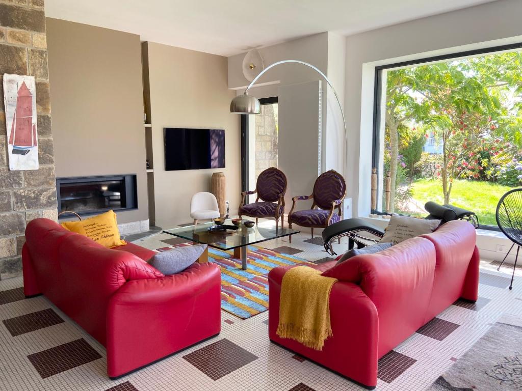 Posezení v ubytování Superbe villa vue sur mer, corniche de la plage