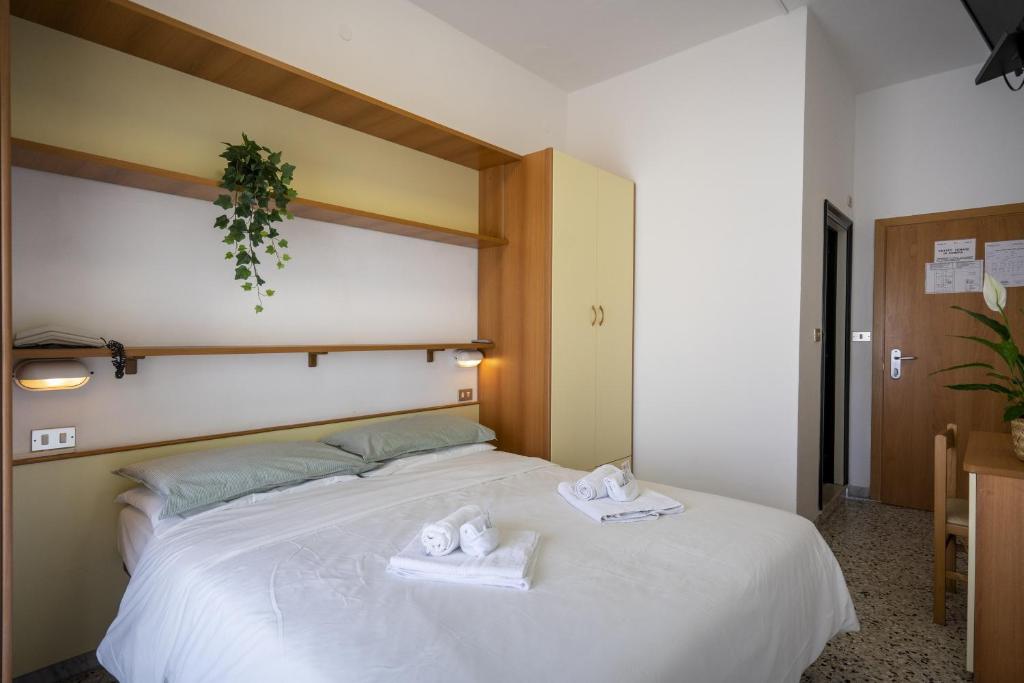 Postel nebo postele na pokoji v ubytování Hotel Mamy