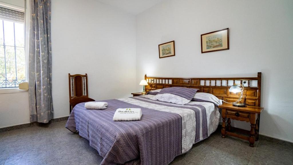 Postel nebo postele na pokoji v ubytování Huerta del Chacho Ronda by Ruralidays