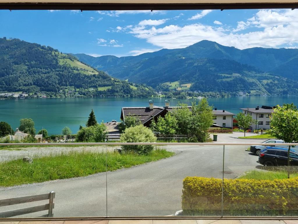 a view of a lake from a house at Panorama Chalet Schmittendrin by we rent, SUMMERCARD INCLUDED in Zell am See