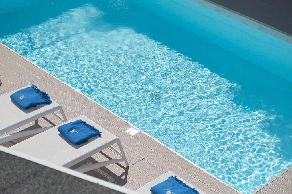 The swimming pool at or near Porto Vecchio Luxury Suites