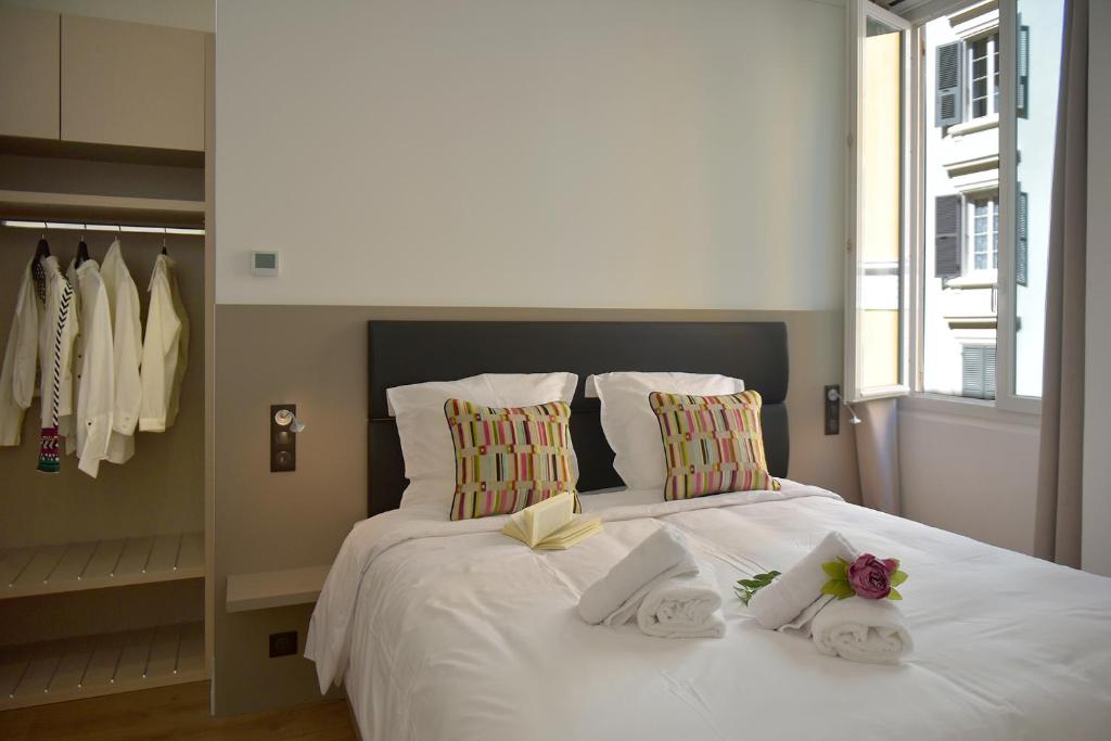 Posteľ alebo postele v izbe v ubytovaní Hôtel Continental
