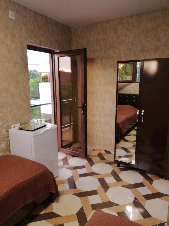 Postel nebo postele na pokoji v ubytování Hotel Kvadrati