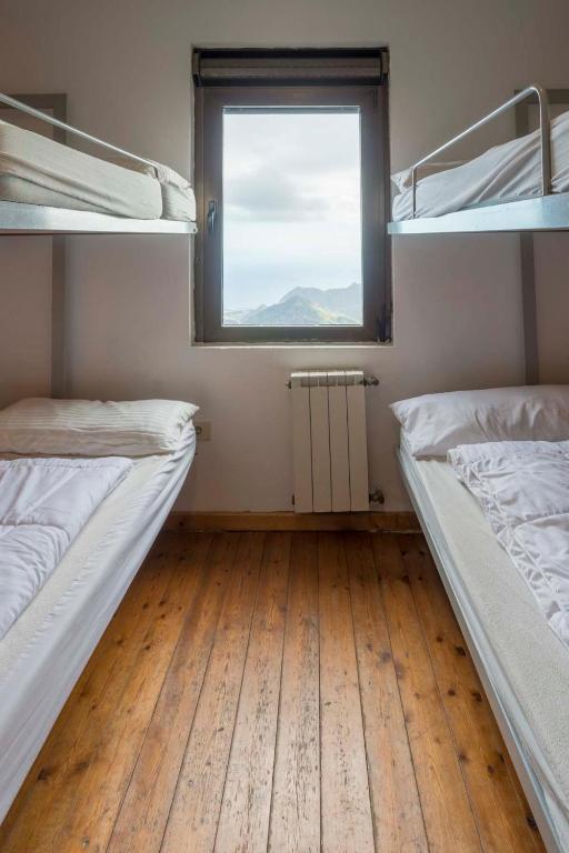 Postel nebo postele na pokoji v ubytování Albergue Montes de Anaga