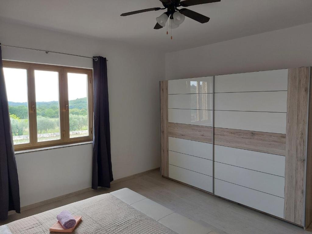 Łóżko lub łóżka w pokoju w obiekcie Apartments Bakša