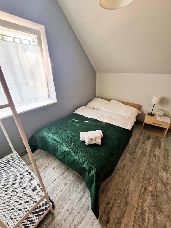 Postel nebo postele na pokoji v ubytování Zielona Przystań