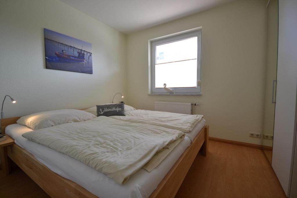 Postel nebo postele na pokoji v ubytování Haus Sir Henry