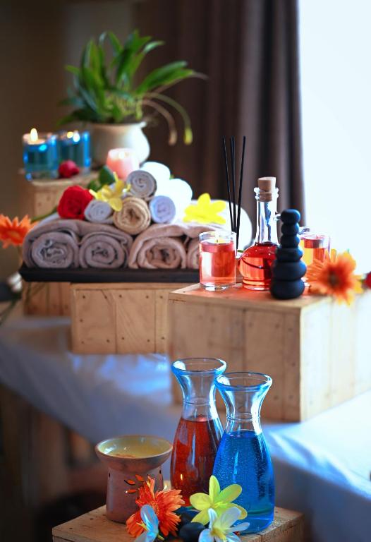 a table with two blue vases on a table at Sarangkot Mountain Lodge in Pokhara