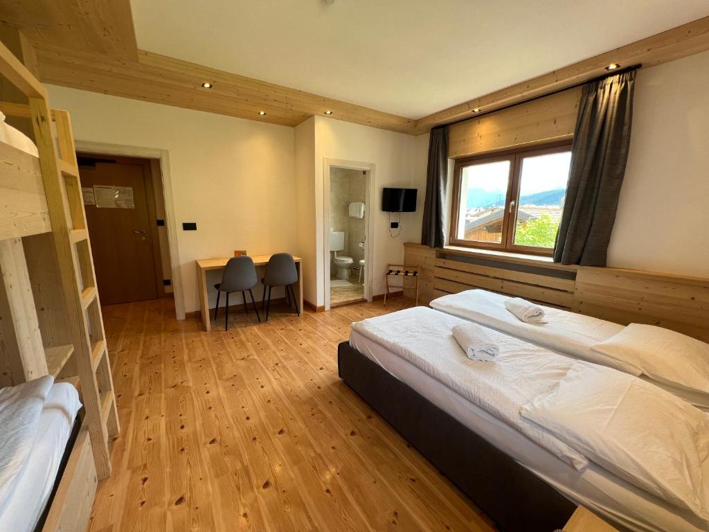 Postel nebo postele na pokoji v ubytování Hotel D'La Varda