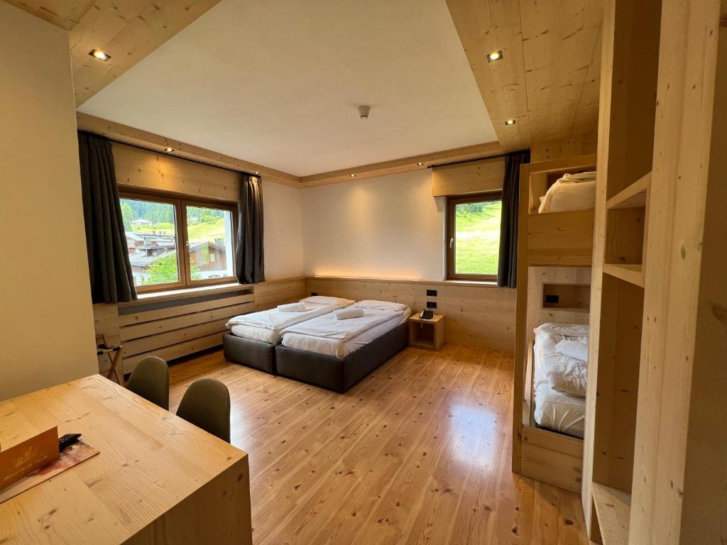 Postel nebo postele na pokoji v ubytování Hotel D'La Varda