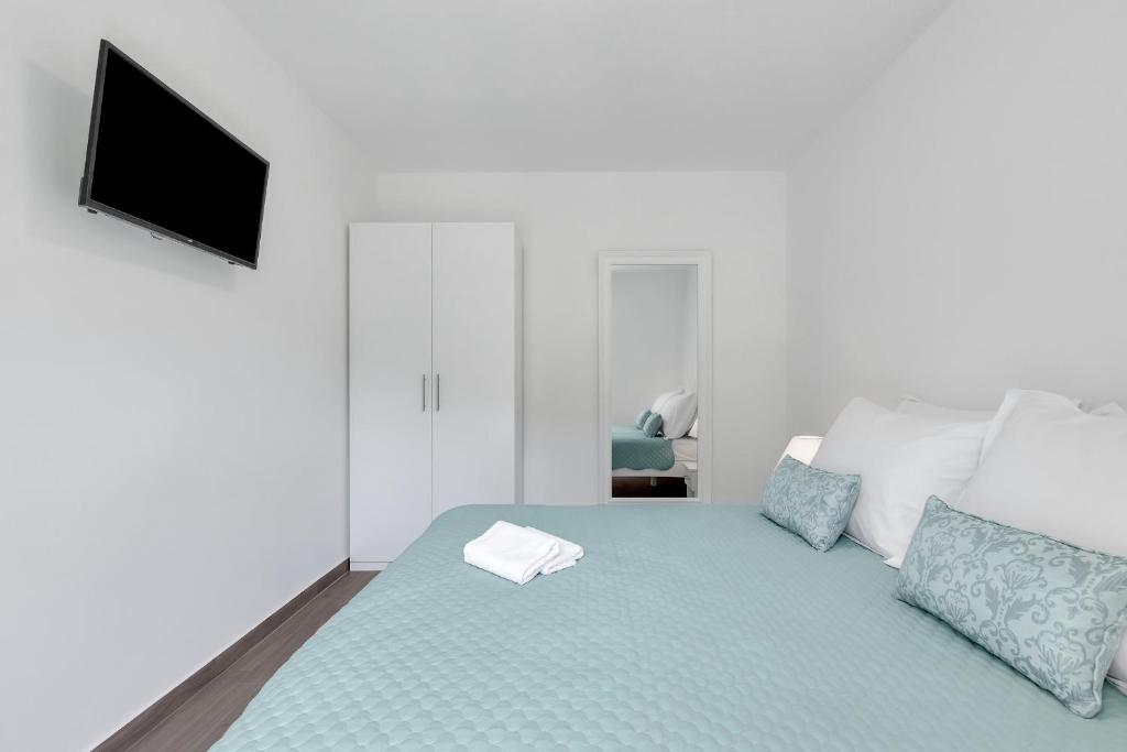 Posteľ alebo postele v izbe v ubytovaní Central Makarska - Apartments Šantrić