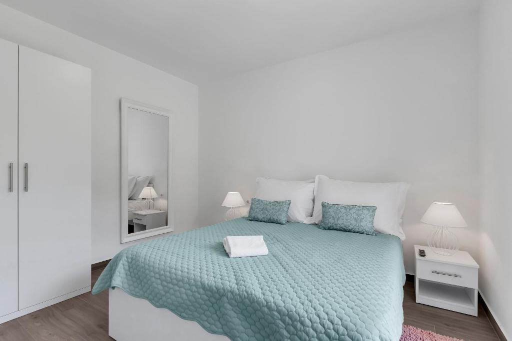 Posteľ alebo postele v izbe v ubytovaní Central Makarska - Apartments Šantrić