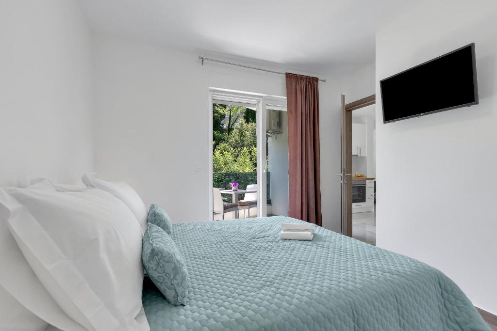 Posteľ alebo postele v izbe v ubytovaní Central Makarska - Apartments Šantrić