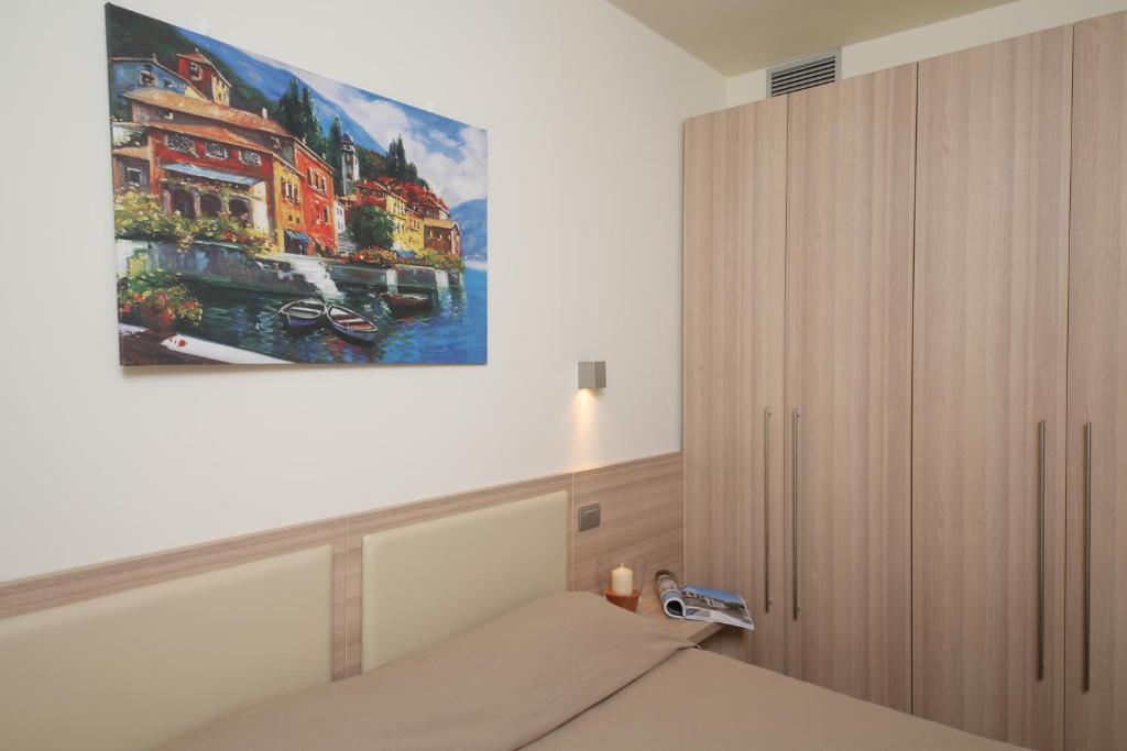 Postel nebo postele na pokoji v ubytování Appartamenti Corte Leonardo