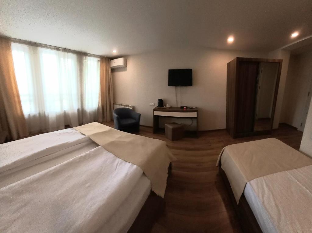 Postel nebo postele na pokoji v ubytování Hotel Lile