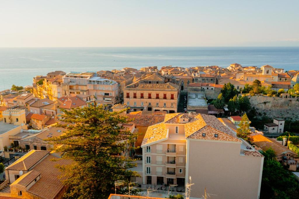 an aerial view of a city with the ocean at ELISEO PALACE TROPEA in Tropea