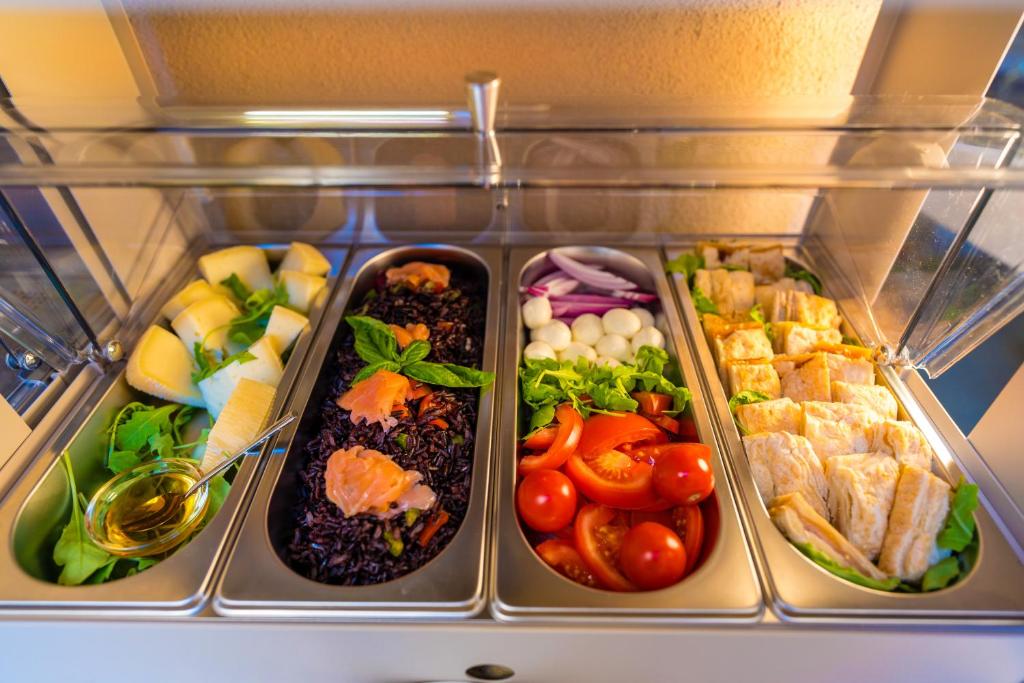 a refrigerator filled with different types of food at ELISEO PALACE TROPEA in Tropea