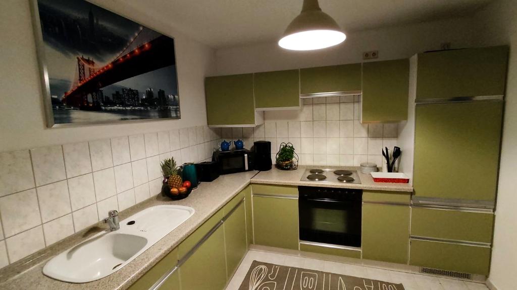 Kuchyň nebo kuchyňský kout v ubytování *Gemütliche Ferienwohnung in perfekter Lage*