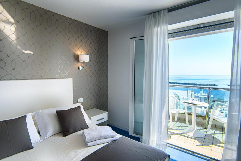 Postel nebo postele na pokoji v ubytování Hotel Gorini