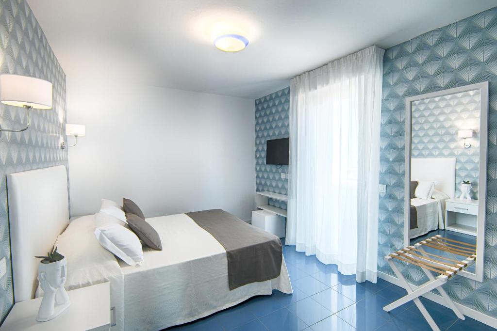 Postel nebo postele na pokoji v ubytování Hotel Gorini