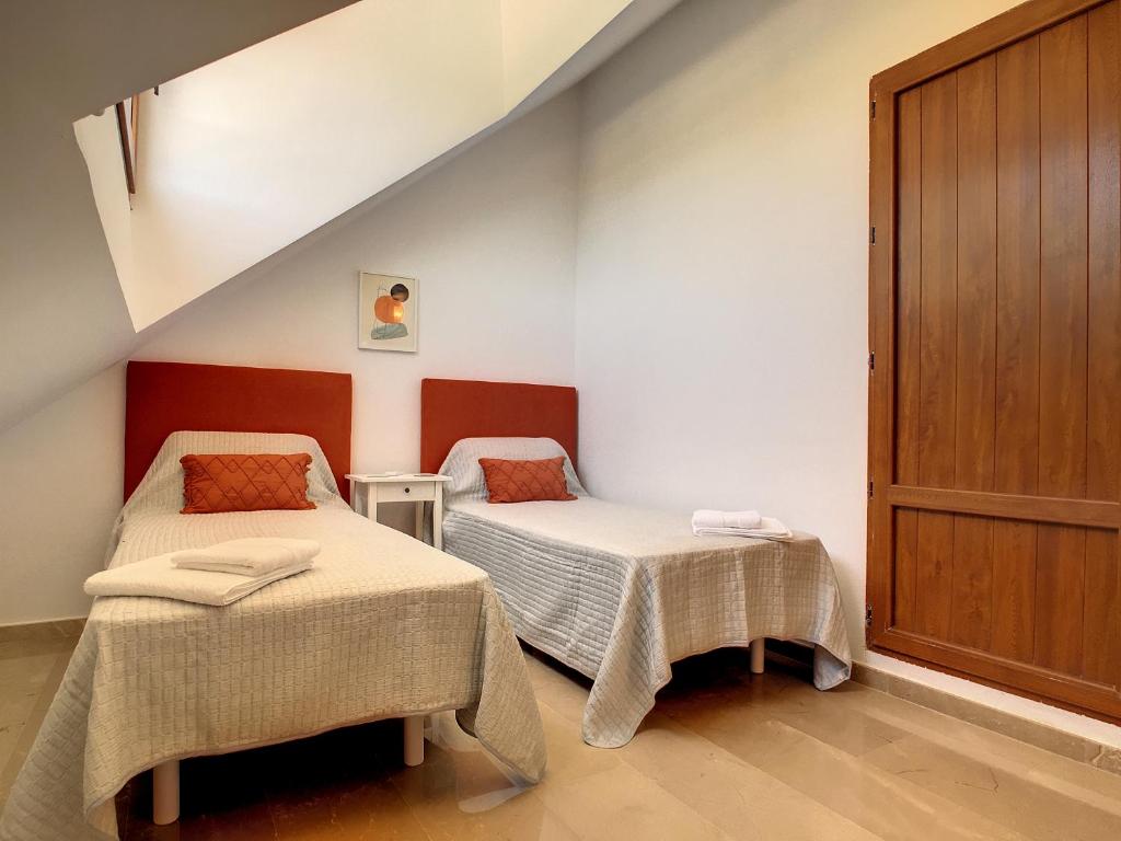 A bed or beds in a room at La Manga Club - Las Atalayas 7709