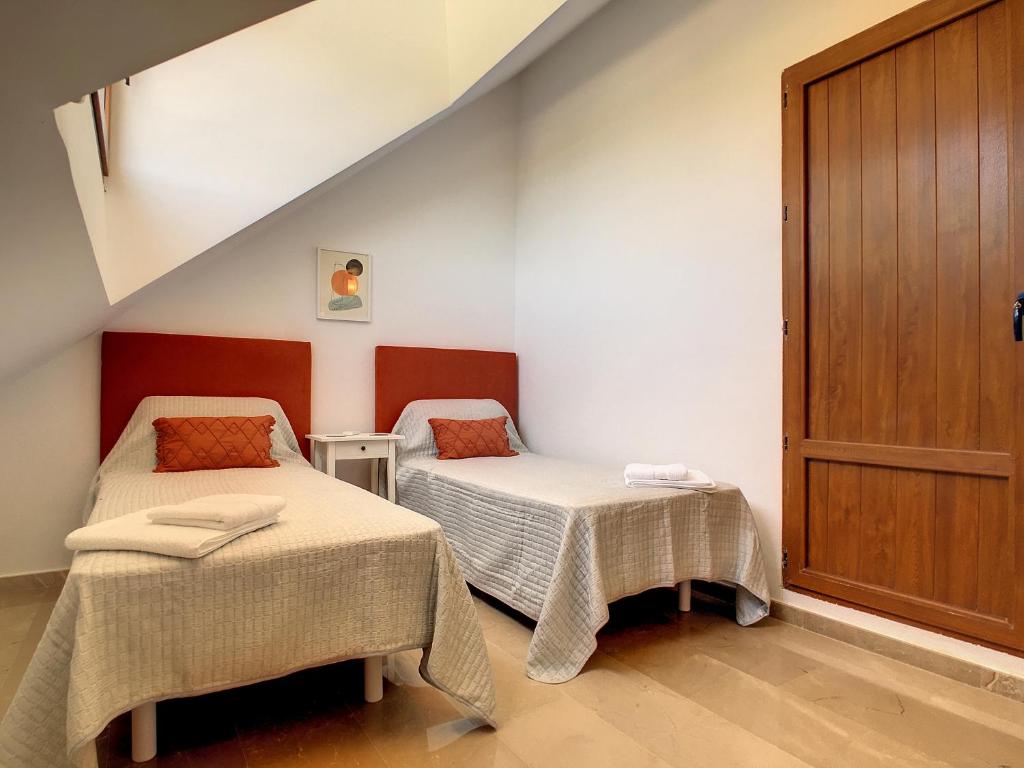 A bed or beds in a room at La Manga Club - Las Atalayas 7709