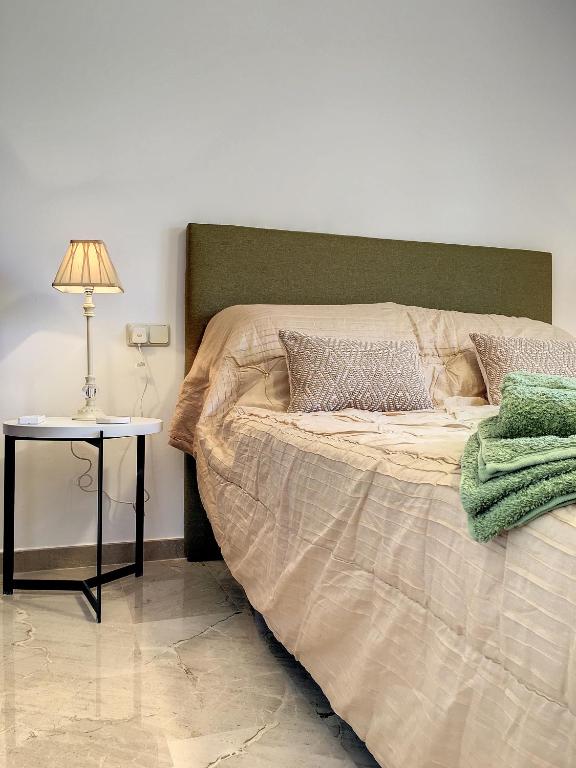 A bed or beds in a room at La Manga Club - Las Atalayas 7709