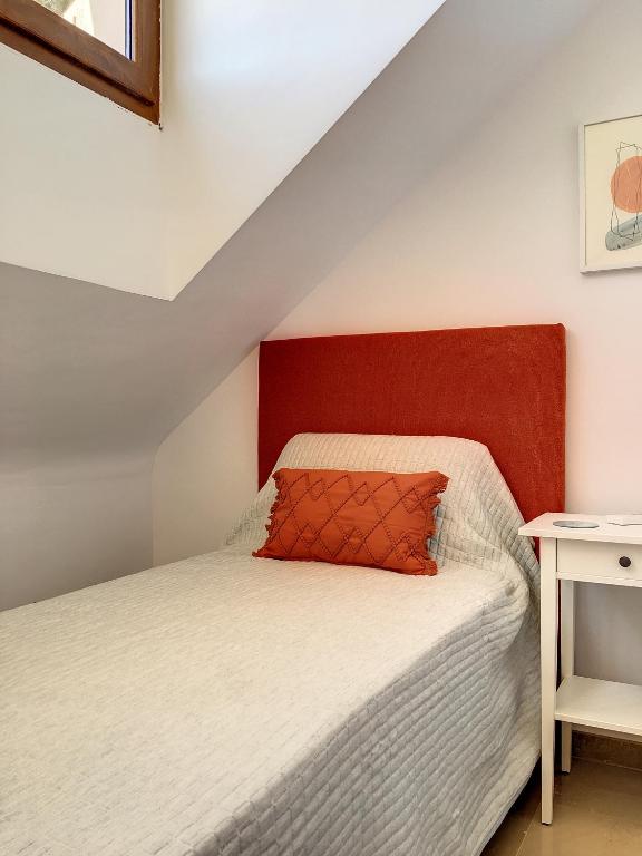 A bed or beds in a room at La Manga Club - Las Atalayas 7709