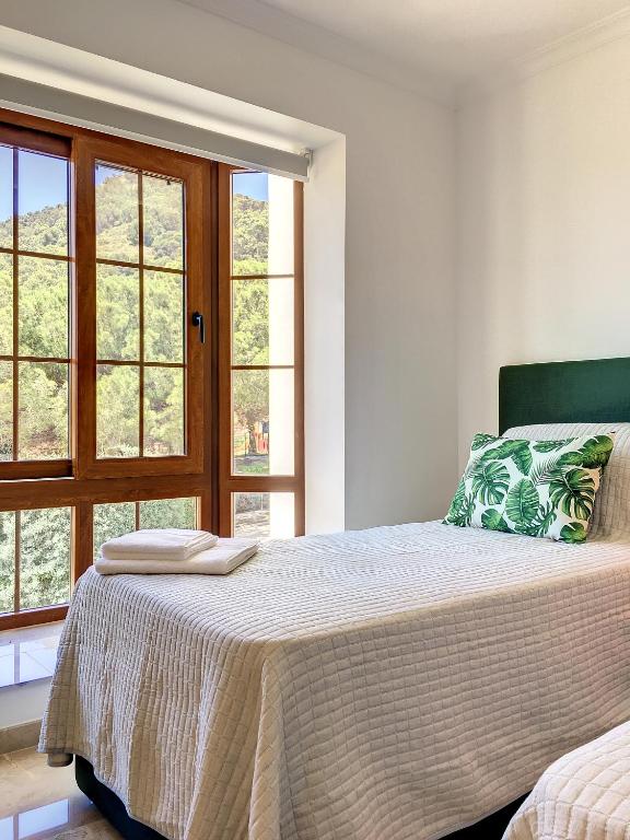A bed or beds in a room at La Manga Club - Las Atalayas 7709