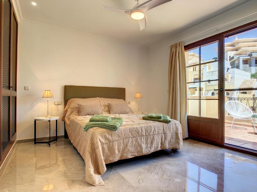A bed or beds in a room at La Manga Club - Las Atalayas 7709