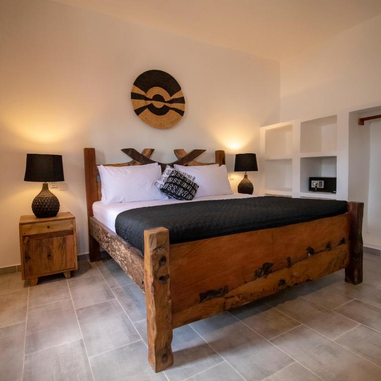 Postel nebo postele na pokoji v ubytování Tamu Tamu Boutique Hotel