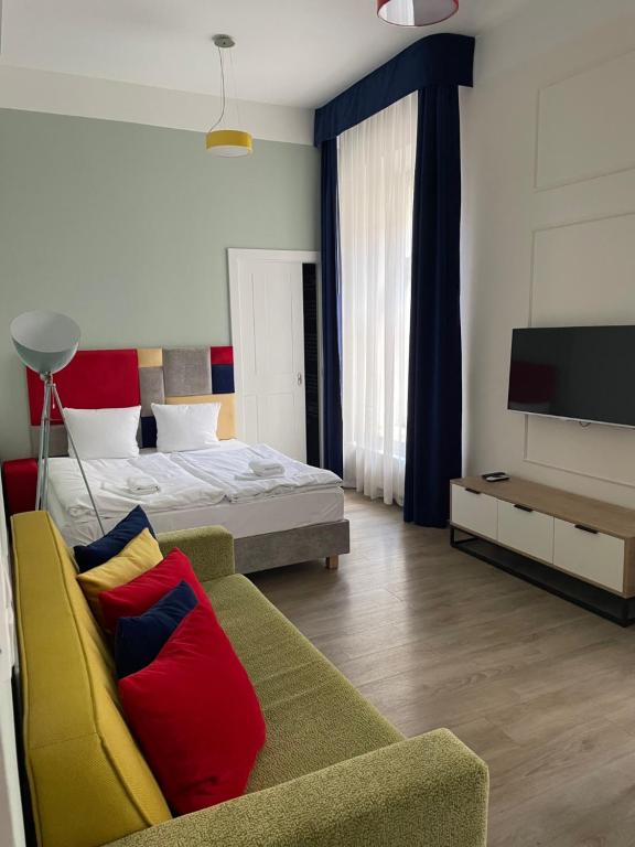 Televízia a/alebo spoločenská miestnosť v ubytovaní Cracow Rentals Zacisze