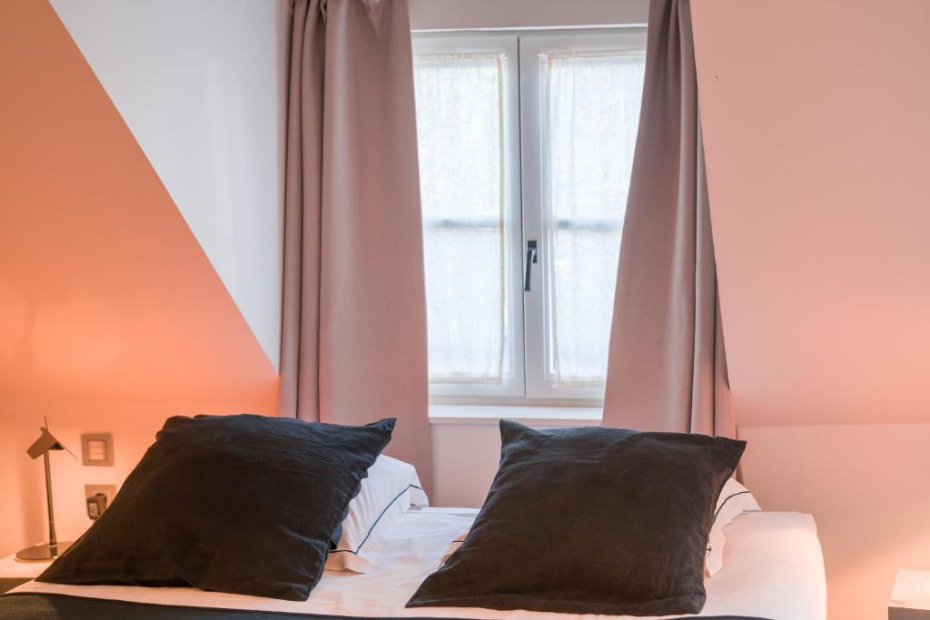 Postel nebo postele na pokoji v ubytování Hotel Neuvice