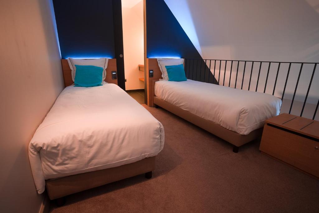 Postel nebo postele na pokoji v ubytování Hotel Neuvice