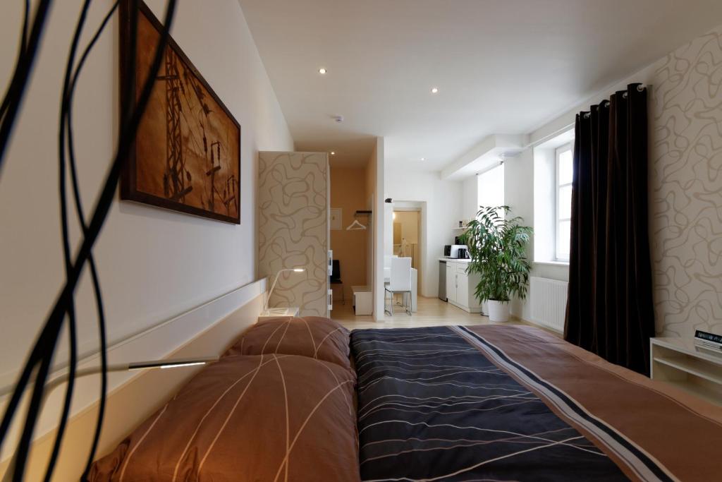 Postel nebo postele na pokoji v ubytování Atrium Apartments