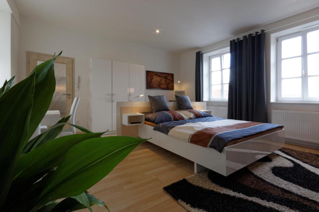 Postel nebo postele na pokoji v ubytování Atrium Apartments