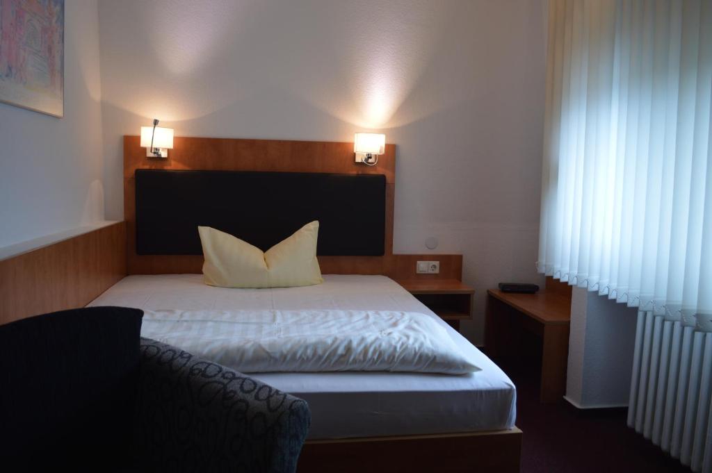 Postel nebo postele na pokoji v ubytování Hotel Scirocco
