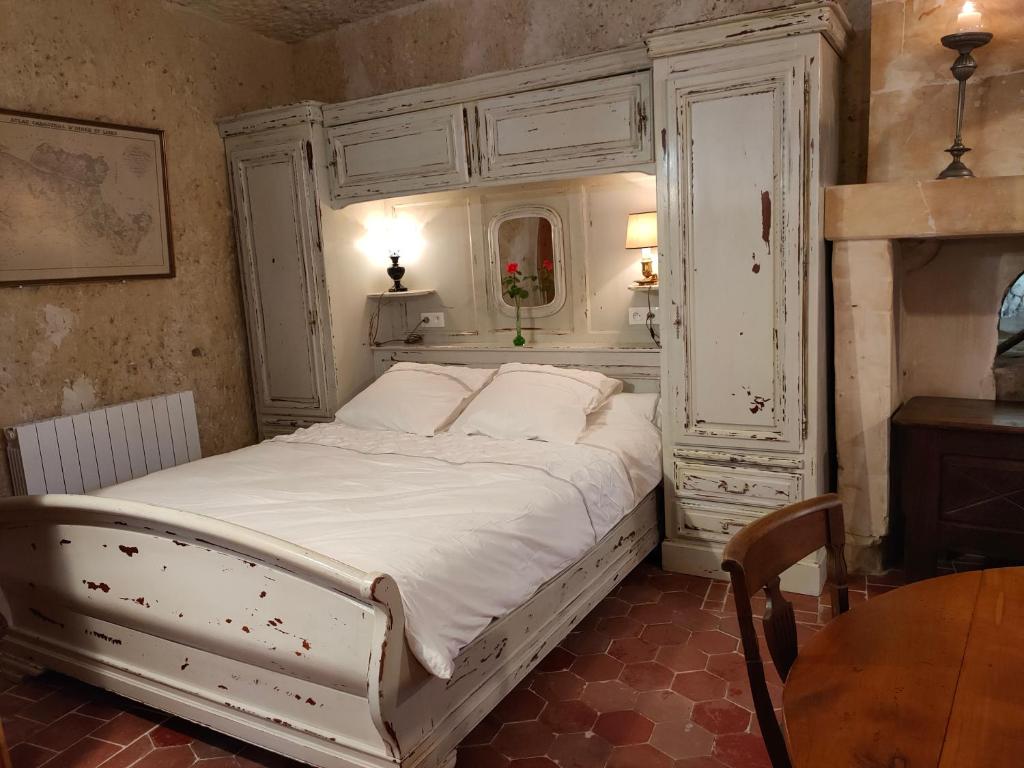 En eller flere senge i et værelse på Aux trois tilleuls