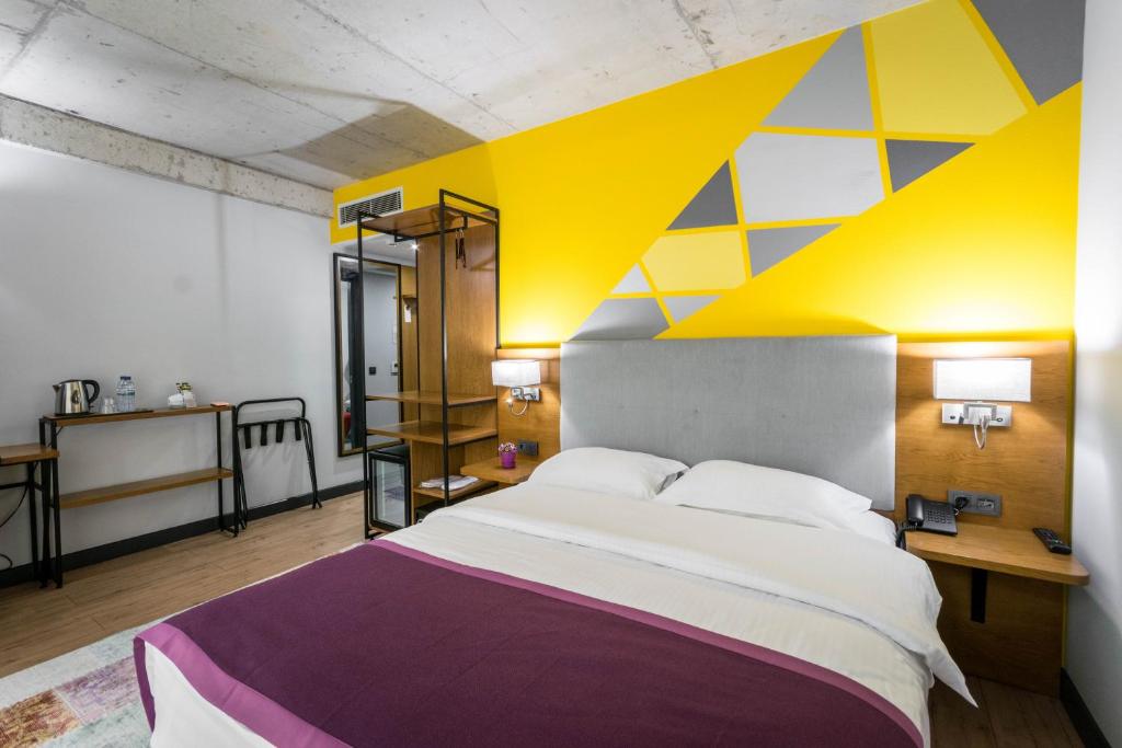 Postel nebo postele na pokoji v ubytování Hotel Adora