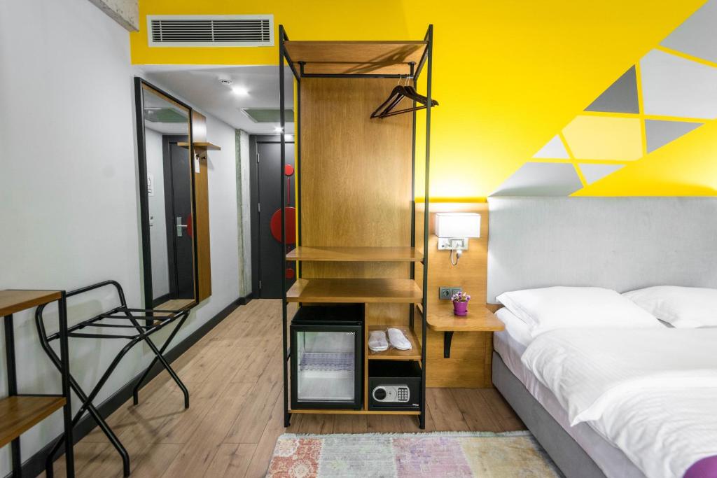 Postel nebo postele na pokoji v ubytování Hotel Adora