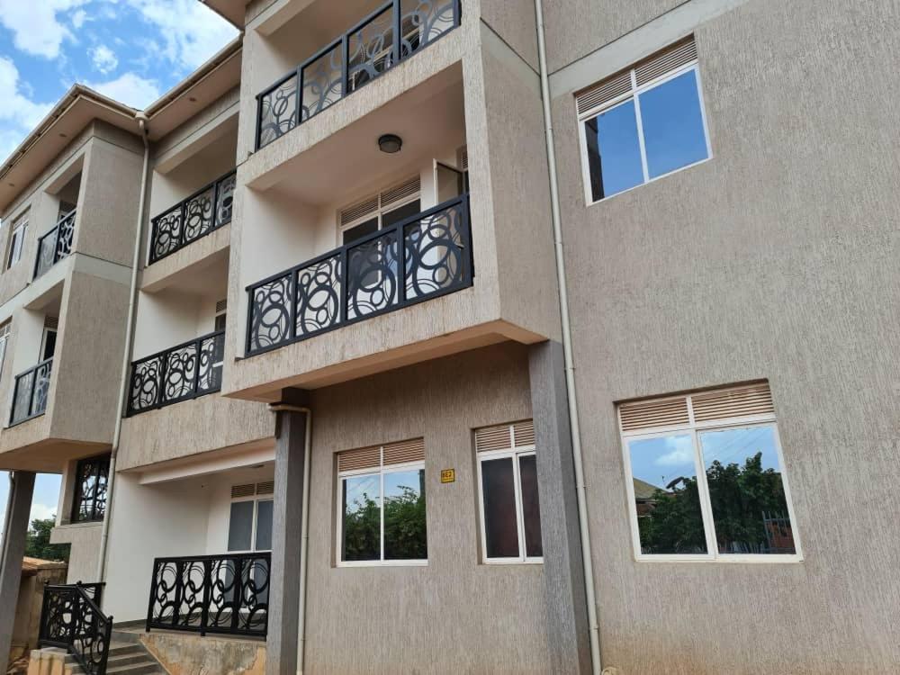a building with balconies and windows on it at Unia fancy flats studio Apartment one in Kampala