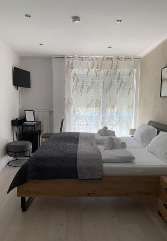 Postel nebo postele na pokoji v ubytování HGH - Hotel Garni Helbig