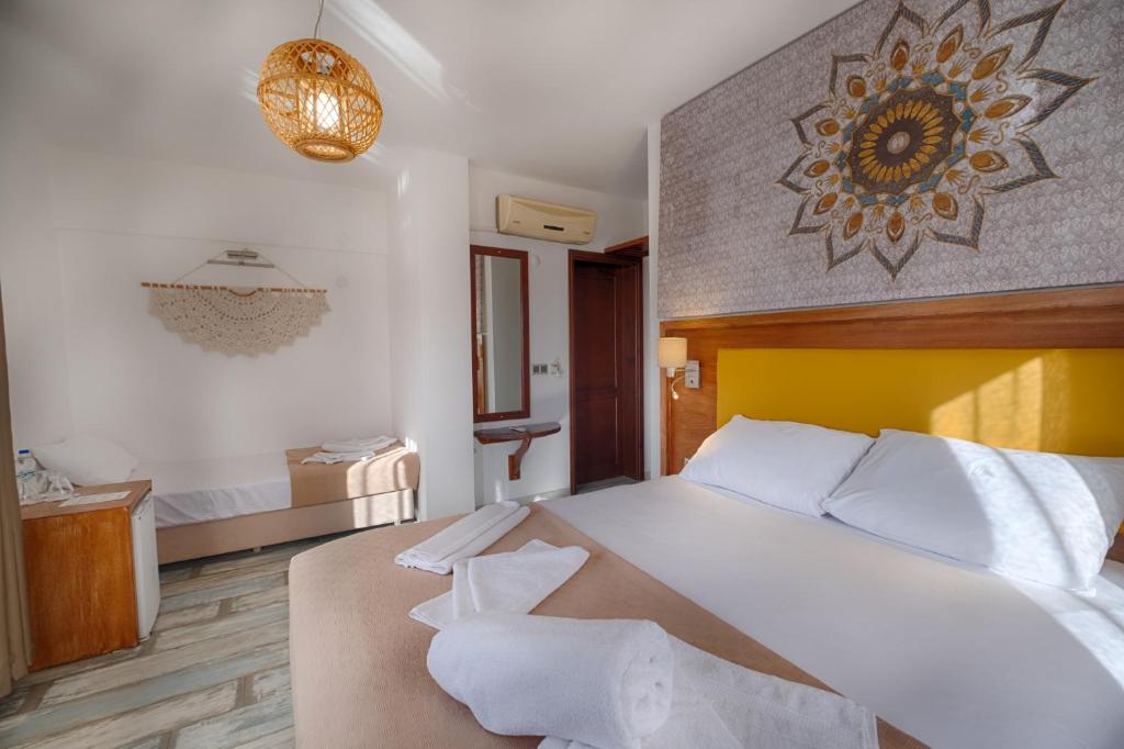 Postel nebo postele na pokoji v ubytování Les Terrasses De Selimiye