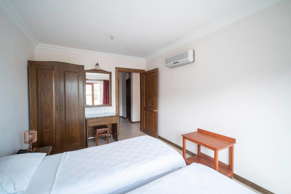 Postel nebo postele na pokoji v ubytování Fora Apart Hotel