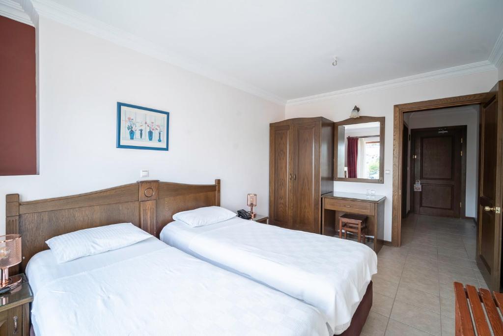 Postel nebo postele na pokoji v ubytování Fora Apart Hotel