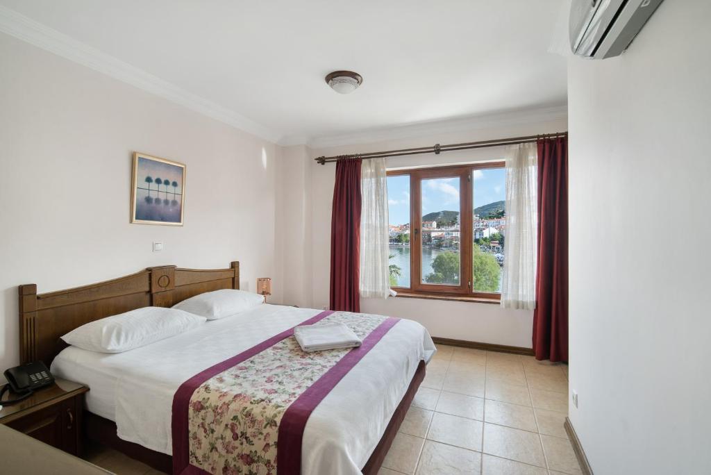 Postel nebo postele na pokoji v ubytování Fora Apart Hotel