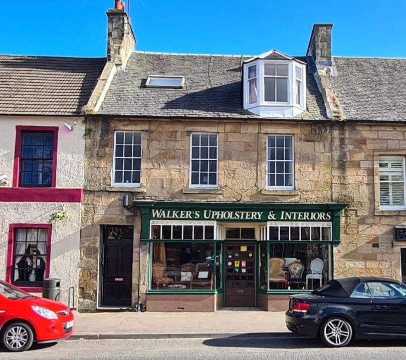 a car parked in front of a building at Bonnygate in Fife