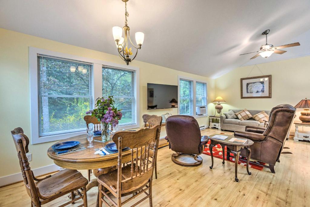 a dining room and living room with a table and chairs at Charming Rural Escape Near Dtwn and Beaches! in Frankfort