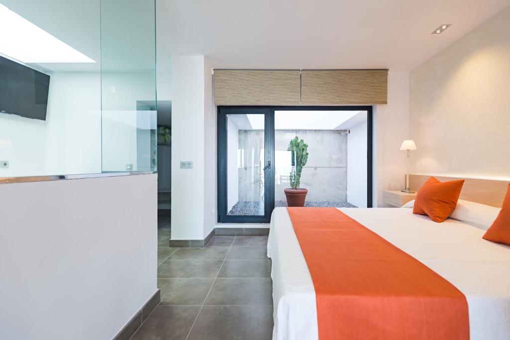 Postel nebo postele na pokoji v ubytování Altos de la Gloria Beach Apartments